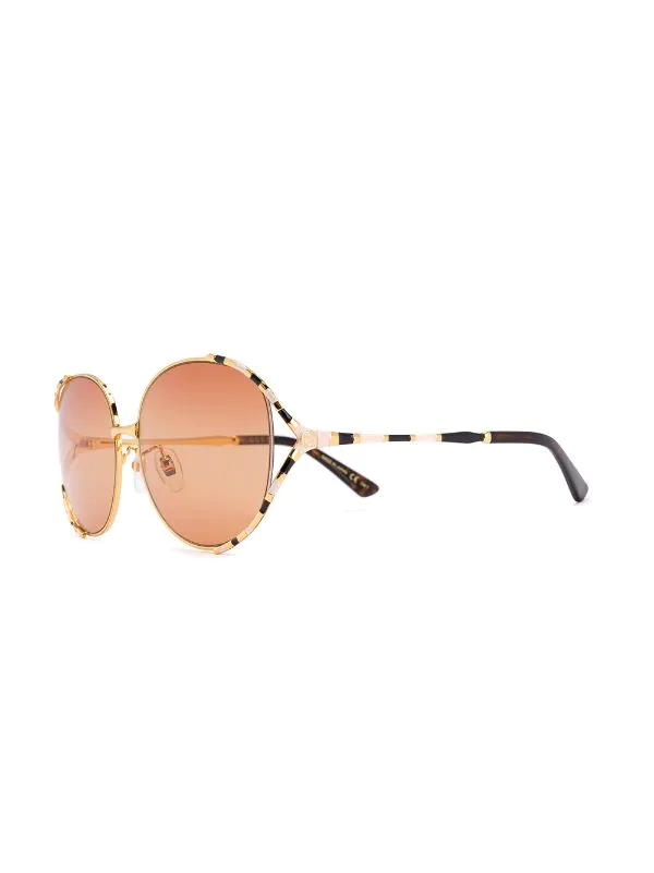 Gucci Eyewear Lunettes De Soleil à Monture Ronde Rayée 003 GOLD GOLD ORANGE 2 Gucci Eyewear Lunettes De Soleil à Monture Ronde Rayée 003 GOLD GOLD ORANGE – Image 2