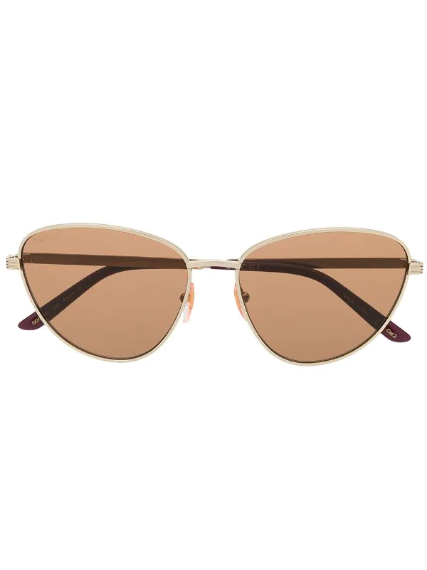 Gucci Eyewear Lunettes De Soleil à Monture Ovale 002 GOLD GOLD BROWN 1 Gucci Eyewear Lunettes De Soleil à Monture Ovale 002 GOLD GOLD BROWN