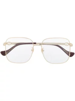 Gucci Eyewear 002 GOLD GOLD TRANSPARENT Lunettes De Vue à Monture Carrée Femme